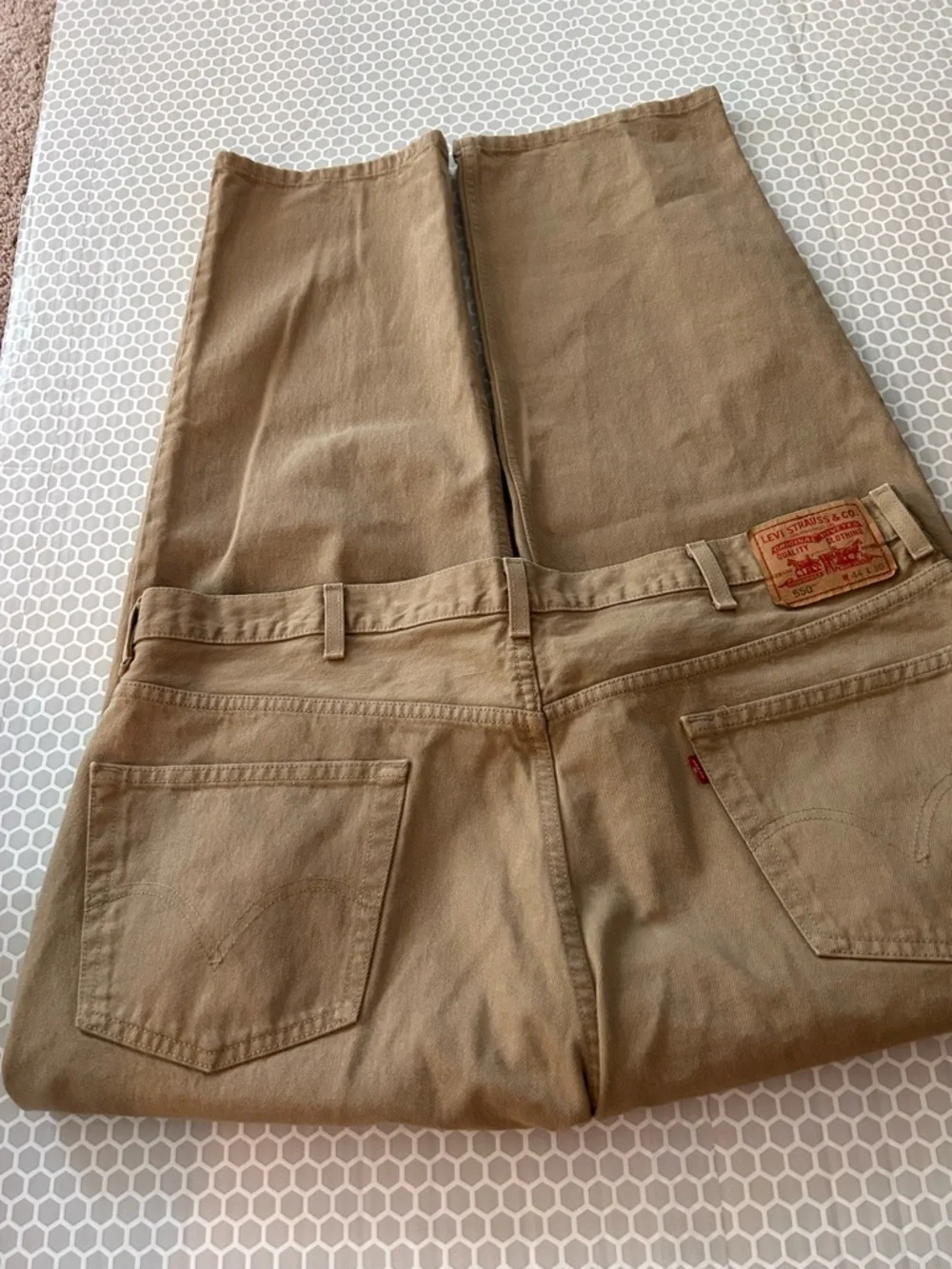 Levi's relaxed fit 550 jeans in khaki tan.  Size 44X30. Cotton